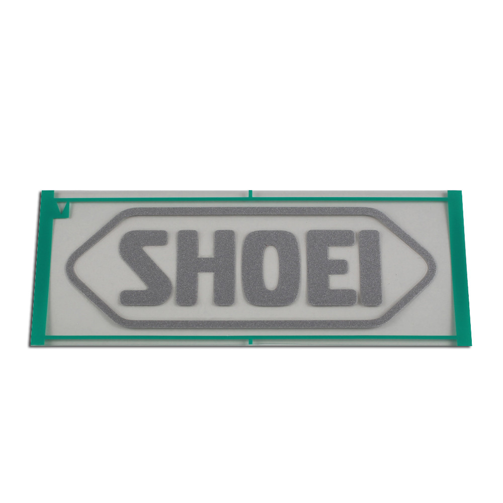 [090HL95MTSLV] Recambio Shoei Logo Frontal 95MM Gris Mate